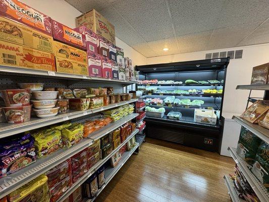 Left side of the store, 1 of 3 fridges, produce