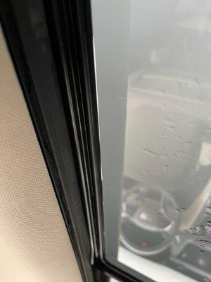 Vizion AutoSports - Bubbles in the roof tint, gaps in the edges, and loose tint hanging down.