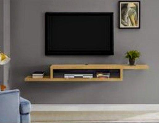 Tv and accessories mounted to wall