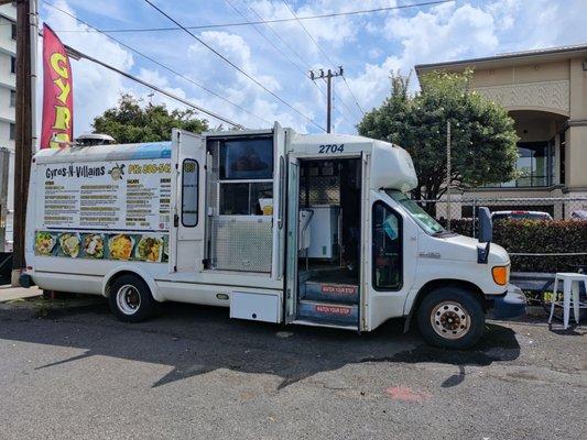 It's a Food Truck in the parking lot of Young's Wine & Spirits