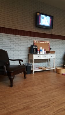 Nice waiting room with TV, magazines, and coffee.