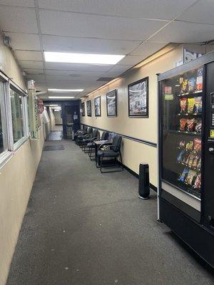 Little waiting area with vending machine and you can watch your car go through the wash