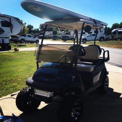 We use our golf cart to transport a paddleboard!