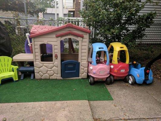 Here is the outside of my daycare. A fun playhouse and lots of cars