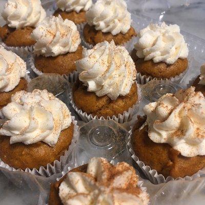 "Pumpkin Gems". Bite size pumpkin muffins with a delicious cream cheese frosting.  Made fresh at our bakery.