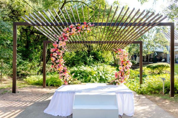 Our unforgettable floral arch for our ceremony that later served as the backdrop for our cake. Photo by Brio Photography.