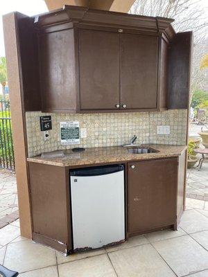 Crumbling kitchen area under gazebo