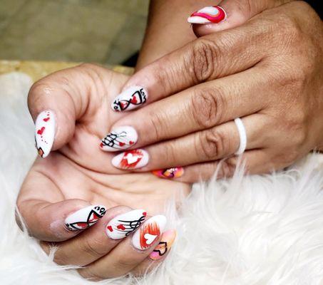 A variety of Valentine's Day nails .