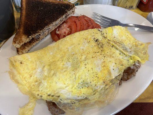 Friday special on a Tuesday. Italian sausage, peppers and onions, omelette with tomatoes (or home fries), toast and coffee. So good