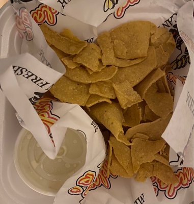 Fried corn chips and white jalapeño cheese for dipping