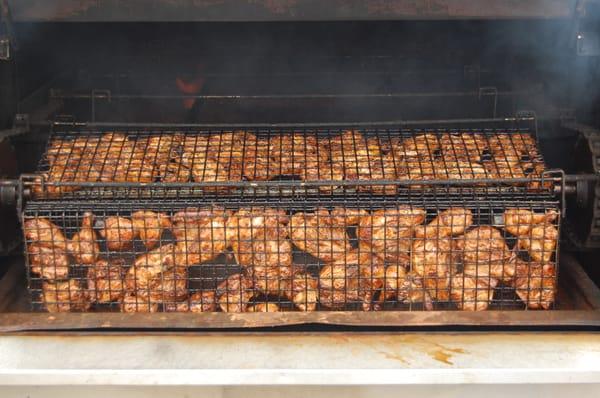 Chicken cooking in the pit