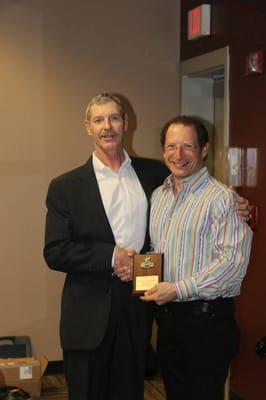 Bernard Hoppenfeld receiving a Sponsor Award from Coach Ralph Frazier at the annual Frazier Cycling dinner...