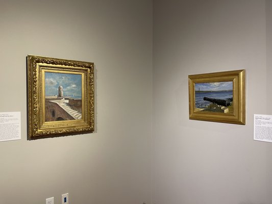 Paintings displayed in ornate frames