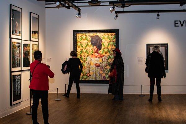 Visitors admiring artworks on view during the opening of "Examining Identity Construction," February 2020.