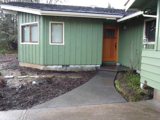 a stamped concrete entry way with a cantilevered step for a custom look