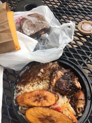 Clockwise: bun and cheese, small jerk chicken with rice and peas, plantains, cabbage and extra gravy, beef patty