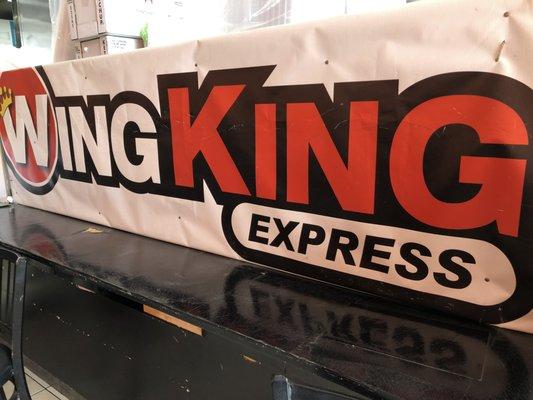 Wing King Express logo banner inside the store.