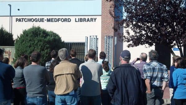 The unveiling of "The Library of Babel" by John Cino at the Patchogue-Medford Library