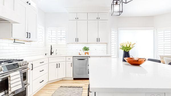 White countertops and cabinets in a remodeled kitchen