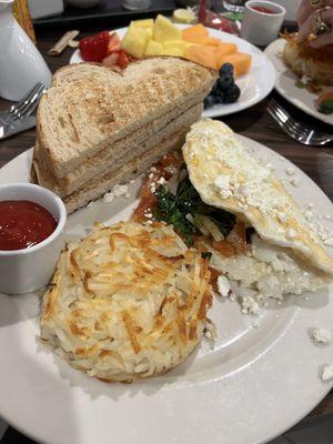 Egg White Omelette with sautéed onions added; crispy Hash Browns, and toast.