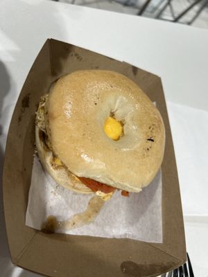 Bagel breakfast sammie with sausage, added tomato