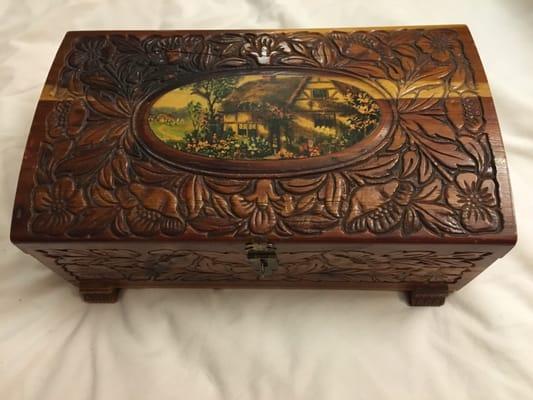 An old carved wooden jewelry box