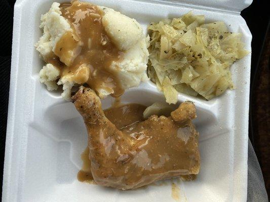 Smothered chicken, cabbage and mashed potatoes.