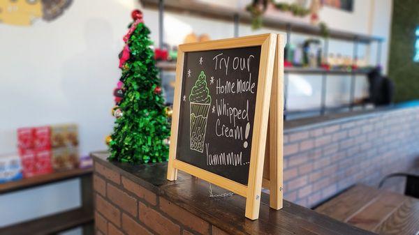 Cute holiday sign.  They make their own whipped cream!