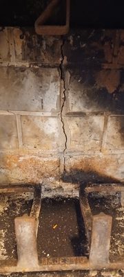 Broken and cracked pre-manufactured fireplace panels