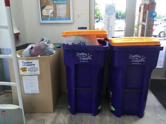 Cradles to Crayons collection bins in the atrium/entry area