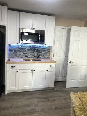 Downstairs cabinet, countertop, sink, and backsplash install