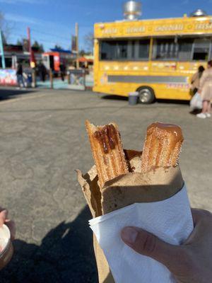 My love got strawberry ice cream with a plain churro