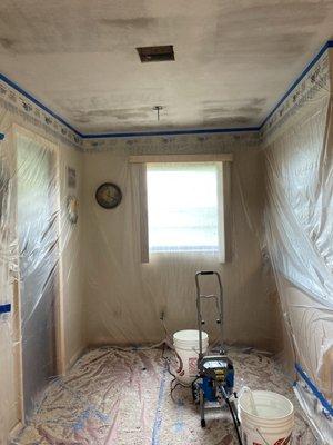 Popcorn ceiling removed.