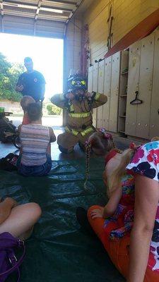 Showing us the equipment and what they will look/sound like during a fire.