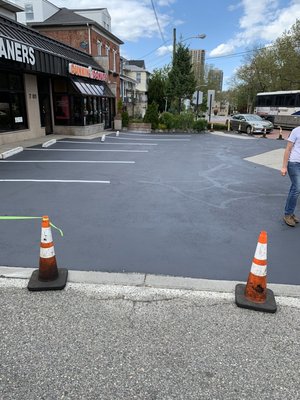 Parking lot sealcoating