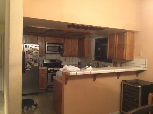 Kitchen with drop ceiling before