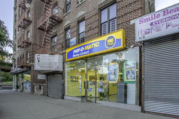 Exterior view from sidewalk of PAYOMATIC store located at 11 East Gunhill Road Bronx, NY 10467