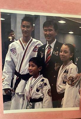 Master Kim at world championships with 3 of his students