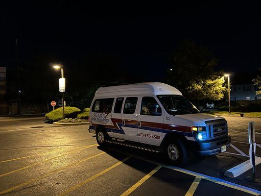 STARS service wheelchair van in front of a residence building at 04:00 AM awaiting transportation for life saving dialysis treatments