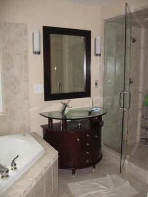 Master bath remodel in Hayward Hills. Steamer shower with frameless enclosure. Corner whirlpool tub & glass bowl vanity sink.