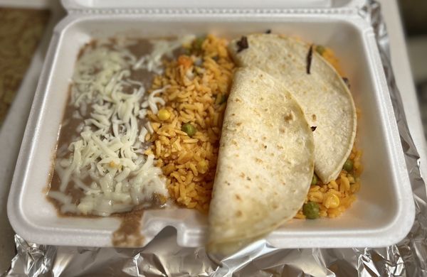 Kids Meal: Two small cheese quesadillas with yellow rice and refried beans.