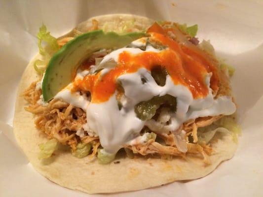 Braised chicken taco with added avocado