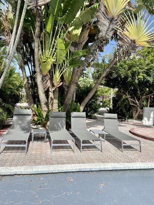 Lounge chairs at one end of the pool