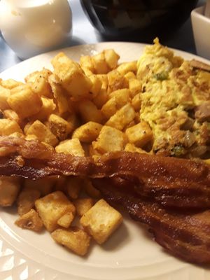 Western omelette,  bacon and home fries.