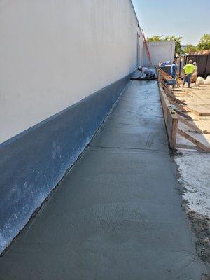 Concrete ADA ramp addition pour.