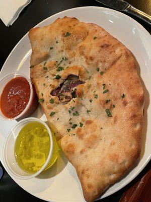 Calzone with three toppings and red sauce