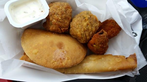 Meat pie, boudin balls, and poppers.