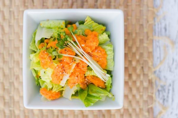 Green salad with carrot ginger dressing