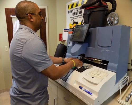 Our Lab Manager working in our Full-Surfacing Laboratory. We can make lenses same day or next day in most cases.