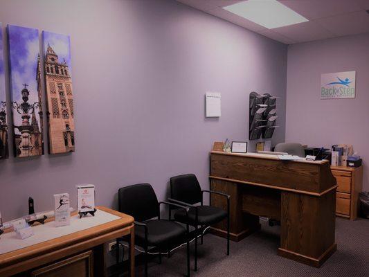 Quiet reception area in a small office building, providing a different experience from the typical physical therapy clinic.